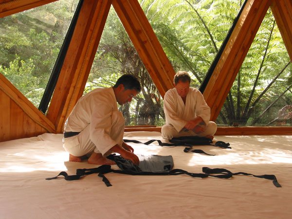 Folding aikido uniform, David Lynch is on the right, Coromandel, New Zealand
