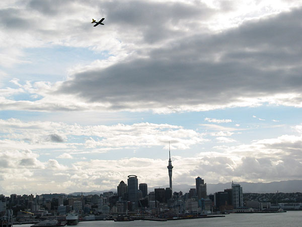 Airplane in the sky and Sky Tower, Devonport, Auckland, New Zealand