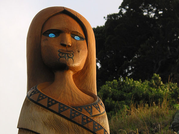 Maori woman. Top of Lion Rock at Piha, Piha beach, Auckland, New Zealand