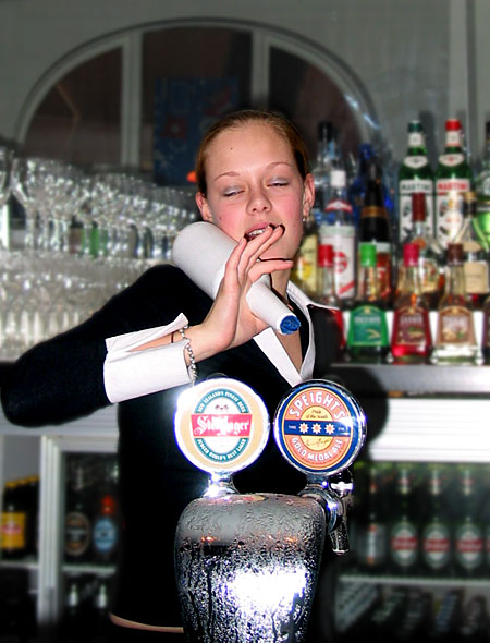 Bartender girl with a bottle at the bar, Auckland, New Zealand