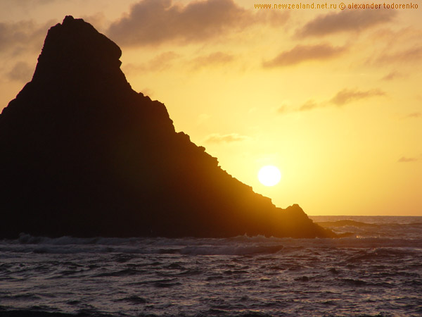 Sunset at Karakare beach, Auckland, New Zealand