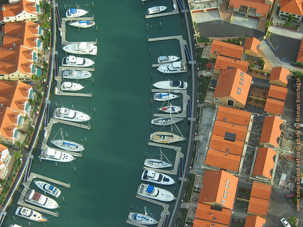 Flying Cessna over Gulf Harbour, Whangaparaoa Peninsula, Auckland, New Zealand