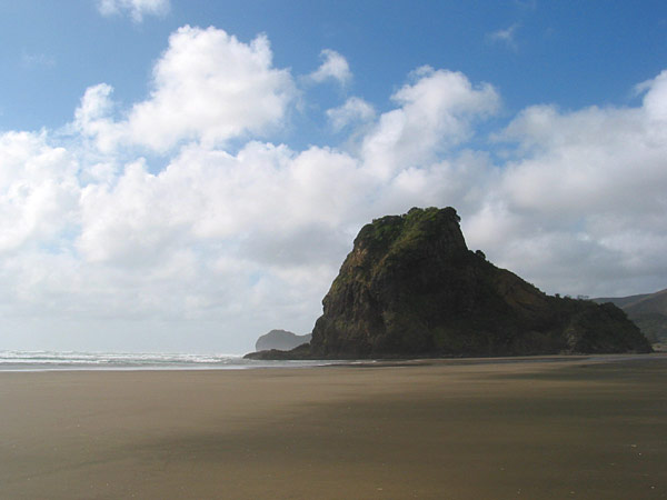 Lion Rock. Low-tide at Piha beach, Auckland, New Zealand
