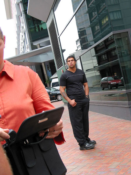 Woman in orange, guy in black, Auckland, New Zealand