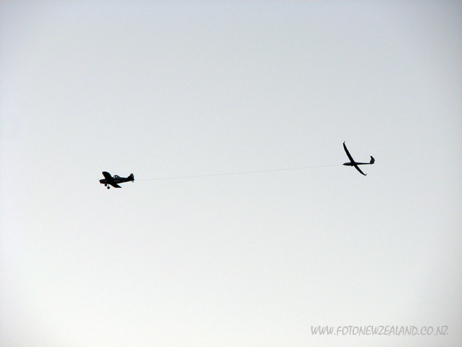 Airplane towing a glider in Makarora, New Zealand