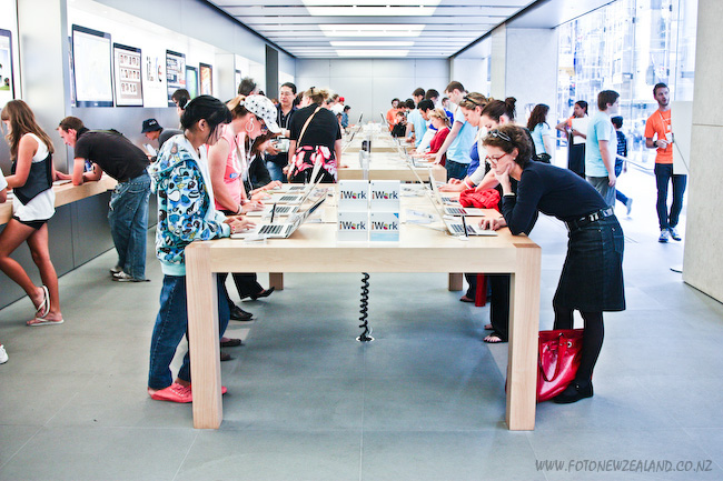 People using the internet on laptops at Apple store in Sydney