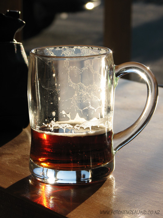 Beer pint glass glowing in the sunshine