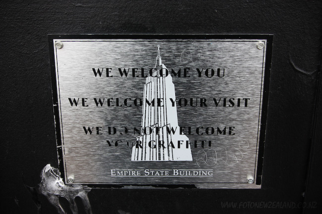 We do not welcome your graffiti sign at the observation deck of the Empire State Building