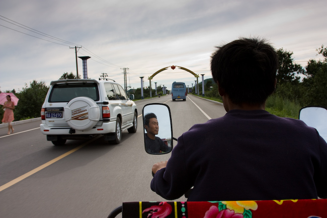 Riding a motor rickshaw in Wudalianchi