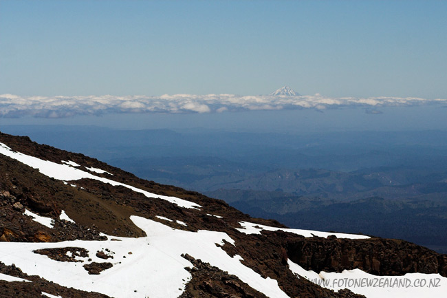 View from Mt Ruapehu, Mt Taranaki's snowy peak is visible in the background