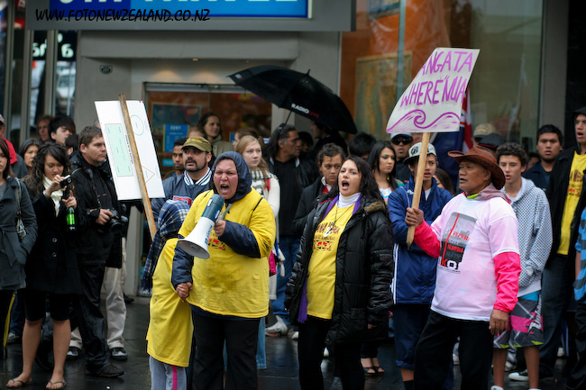 A woman with a megaphone at Maori hikoi in Auckland