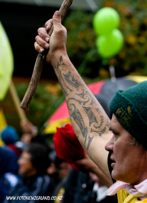Maori tattoo on the hand of a protester in Auckland
